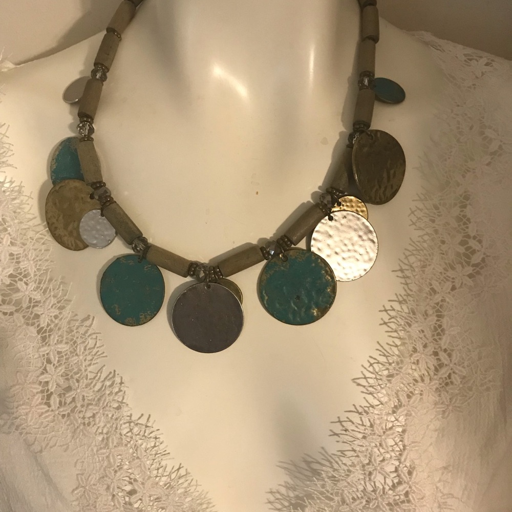 Necklace with distressed metal.